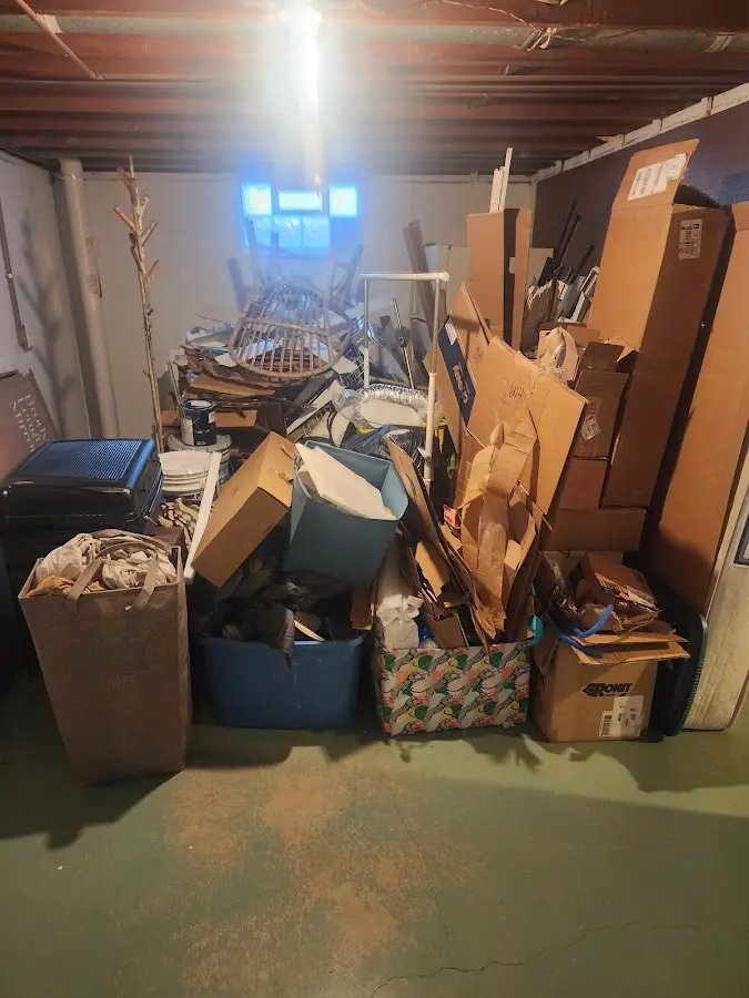 Roll-off dumpster container at job site for Construction Dumpster Rental in Pelham Manor